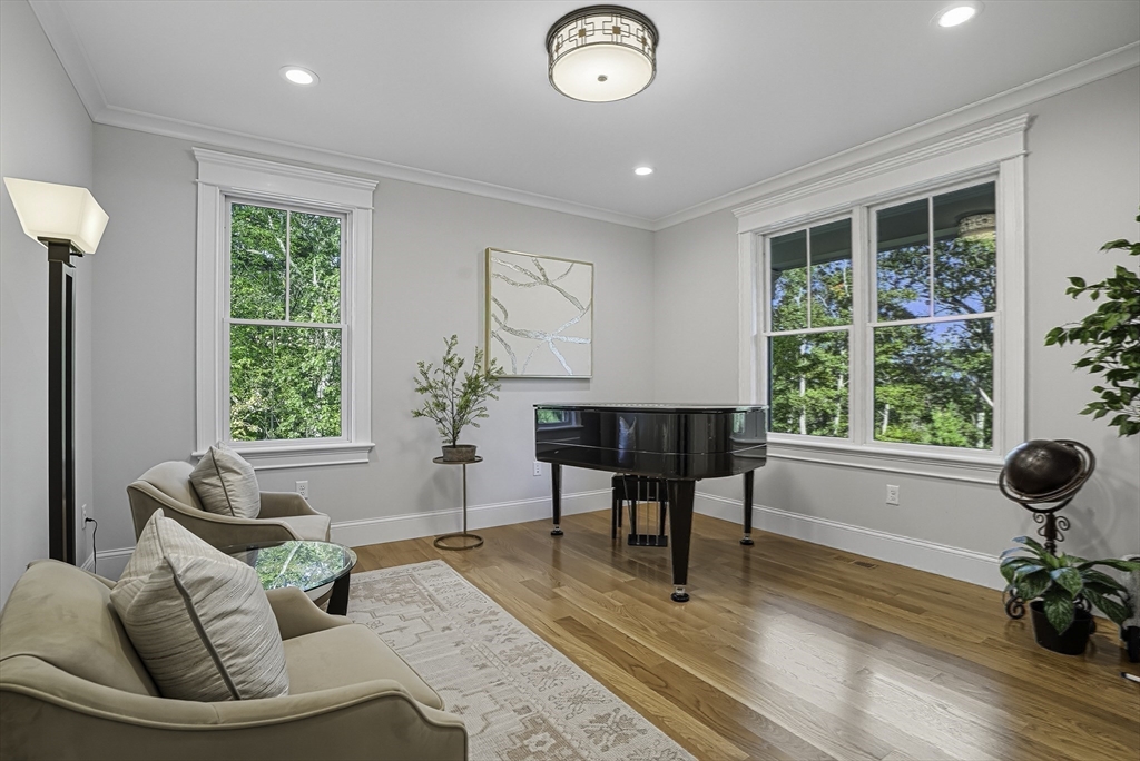 2 Whisper Way Hopkinton, MA 01748 - Photo 16 of 42 a living room with furniture and a large window