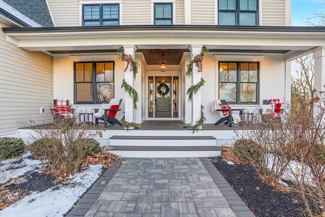 a view of a lobby with a bench and a potted plant