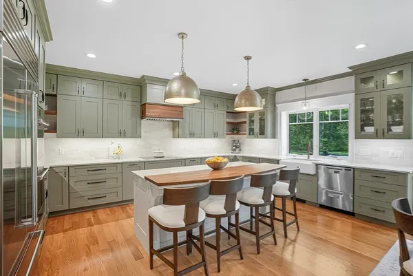 a view of a kitchen with a large window and dining table