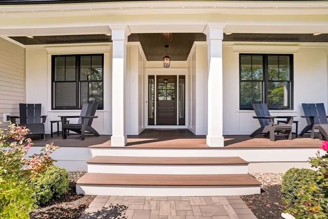 a kitchen with stainless steel appliances white cabinets and a window