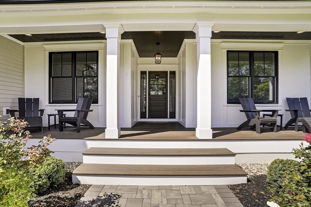 2 Whisper Way Hopkinton, MA 01748 - Photo 7 of 42 a view of a lobby with a bench and a potted plant