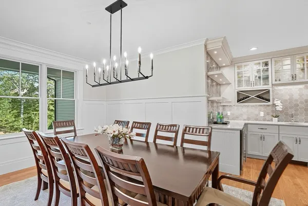 a bathroom with double vanity and a bathtub