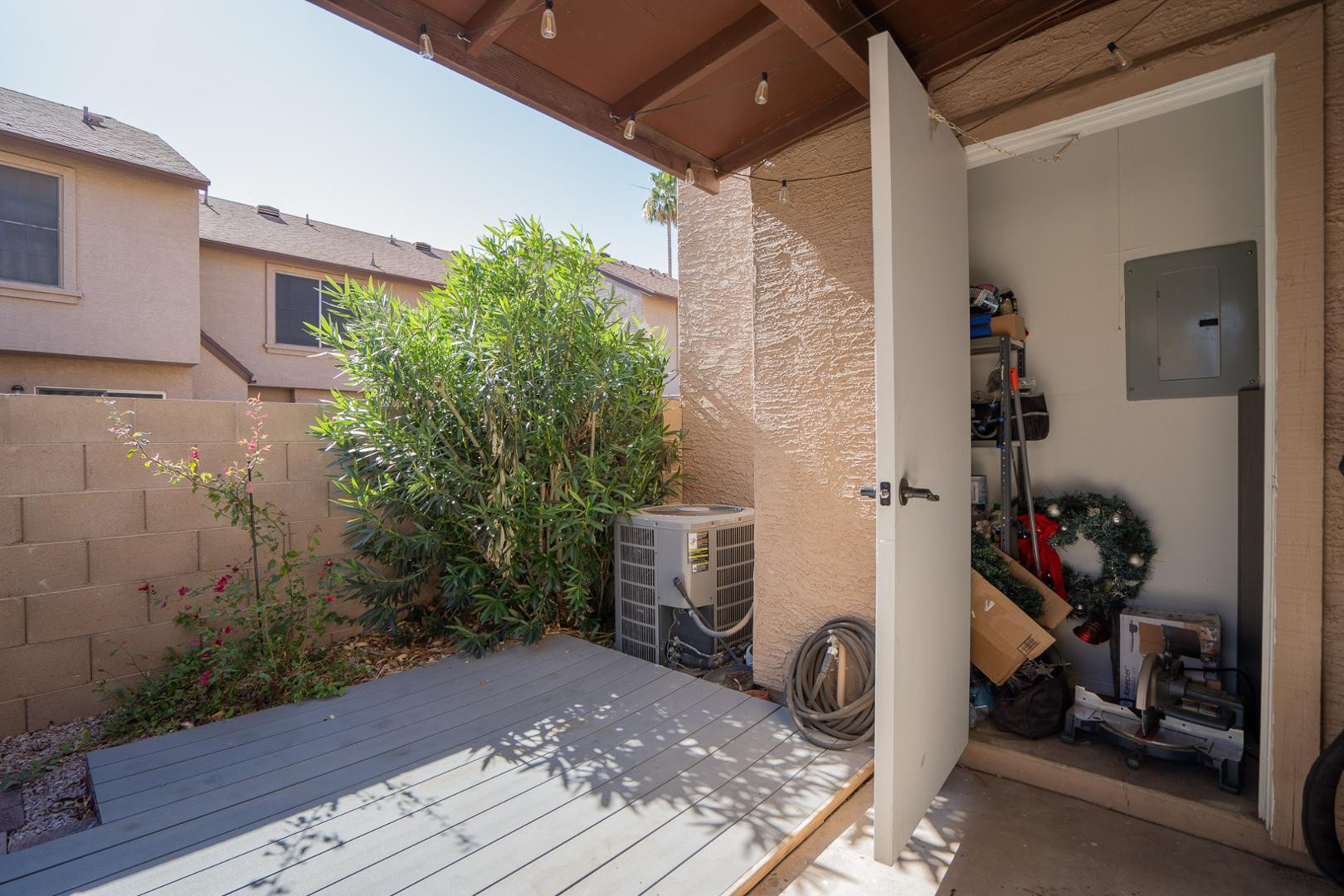 8111 West Wacker Road, Unit 70 Peoria, AZ 85381 - Photo 31 of 38 a view of a door and chair in the patio