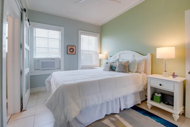 a bedroom with a bed and a fireplace