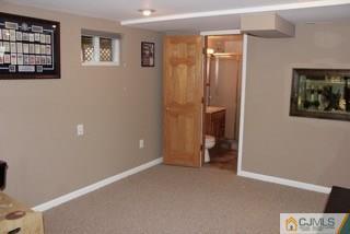 65 Wilk Road Edison, NJ 08837 - Photo 13 of 17 an empty room with windows and closet