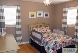 65 Wilk Road Edison, NJ 08837 - Photo 15 of 17 a bedroom with a bed a couch and dresser