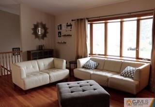 65 Wilk Road Edison, NJ 08837 - Photo 8 of 17 a living room with furniture and a large window