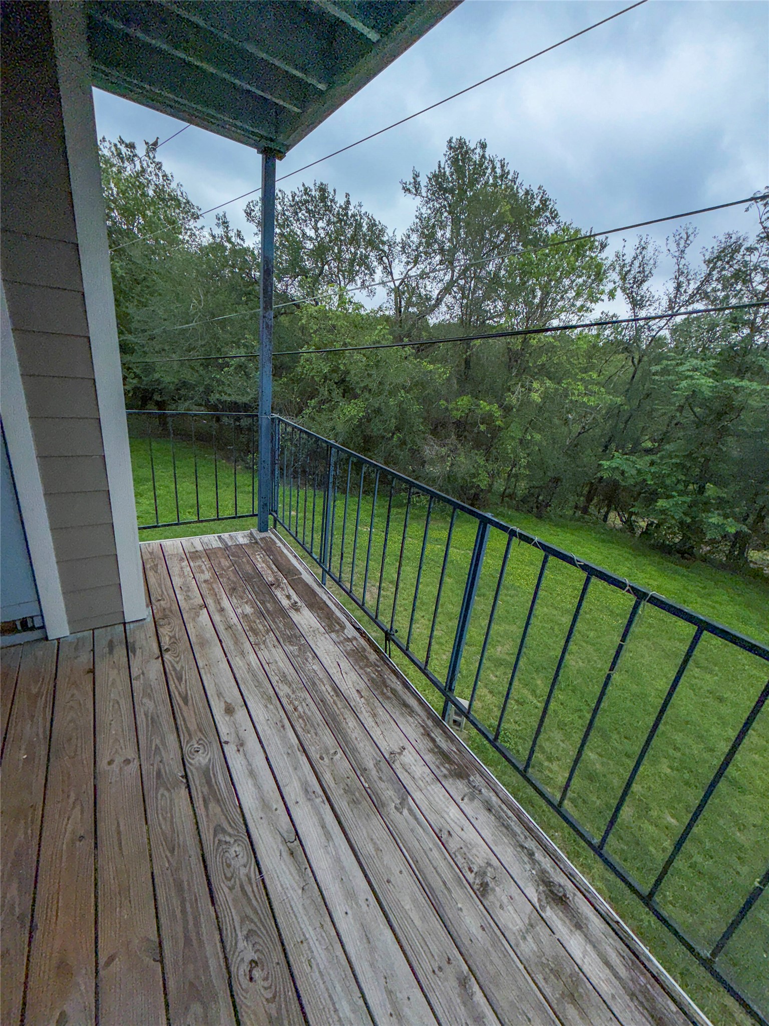 5313 Indio Drive, Unit D Austin, TX 78745 - Photo 16 of 17 a view of balcony with wooden floor and fence
