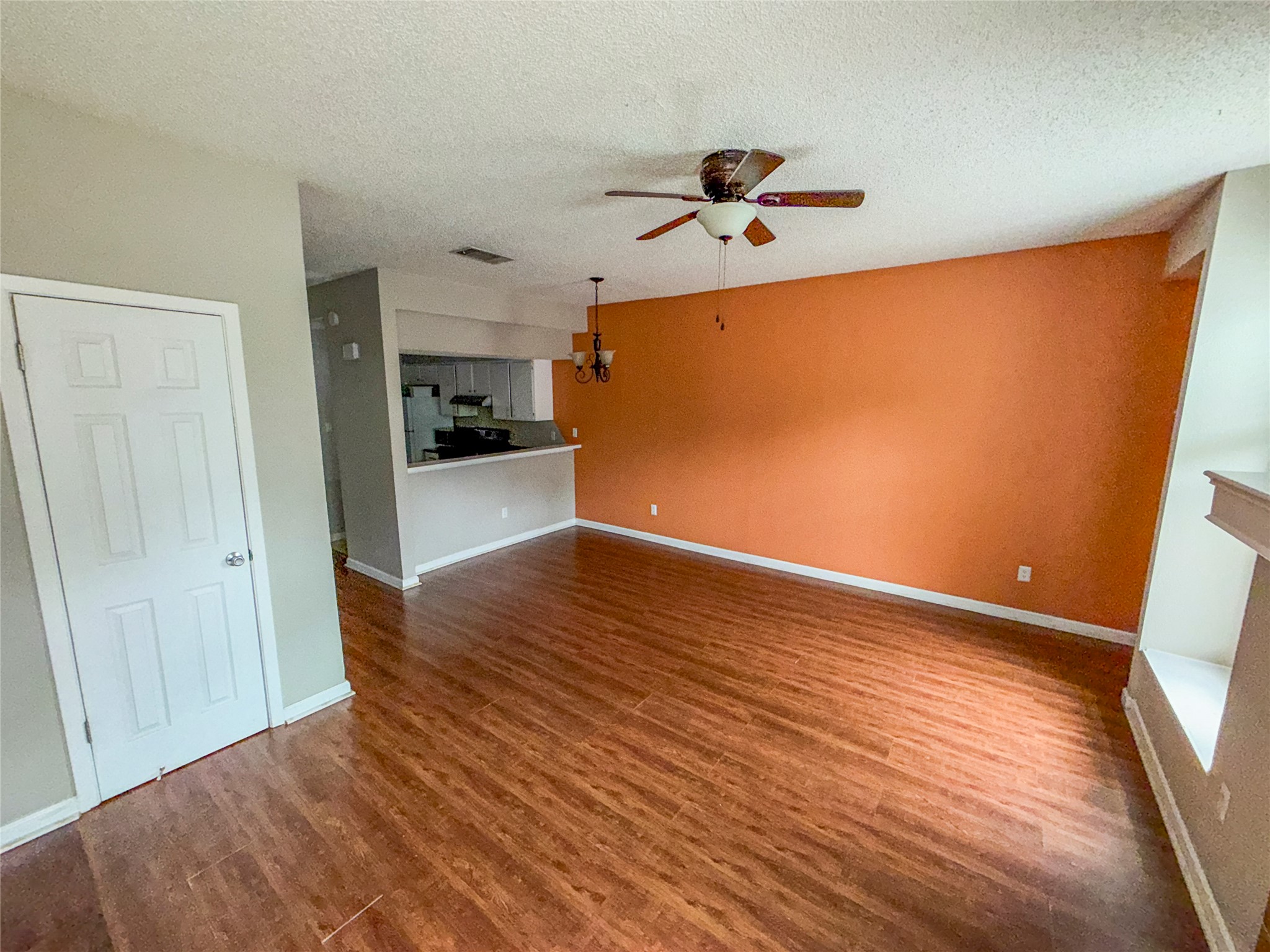 5313 Indio Drive, Unit D Austin, TX 78745 - Photo 3 of 17 a view of empty room with wooden floor and window