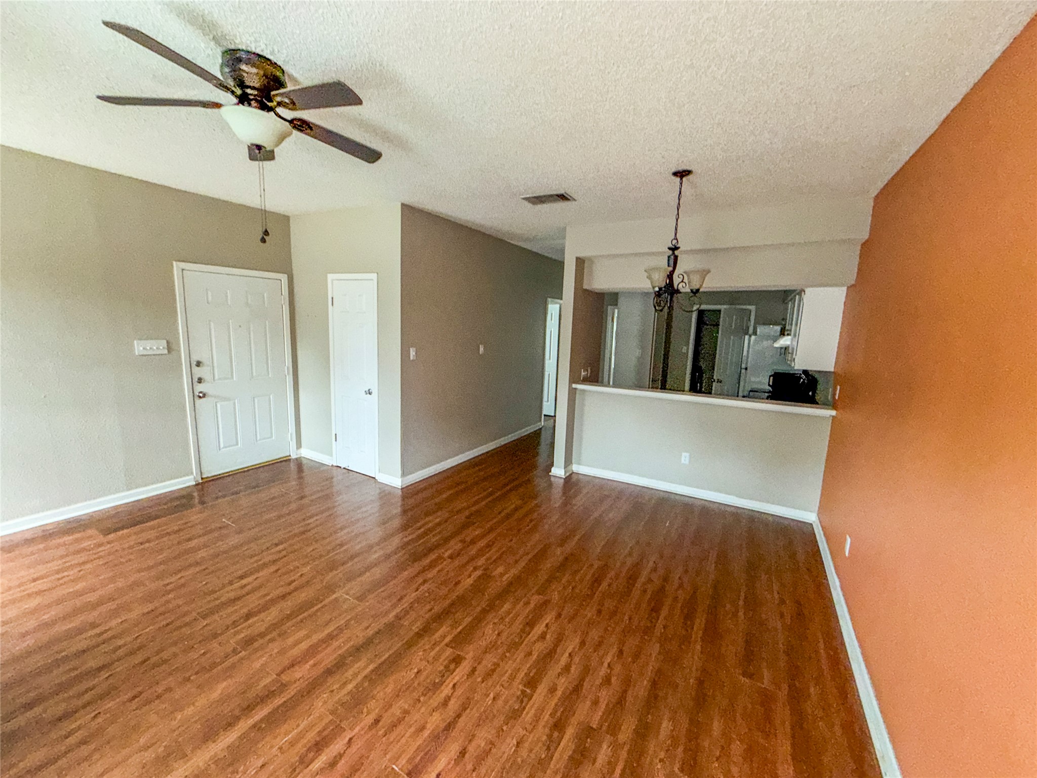 5313 Indio Drive, Unit D Austin, TX 78745 - Photo 4 of 17 a view of empty room with wooden floor