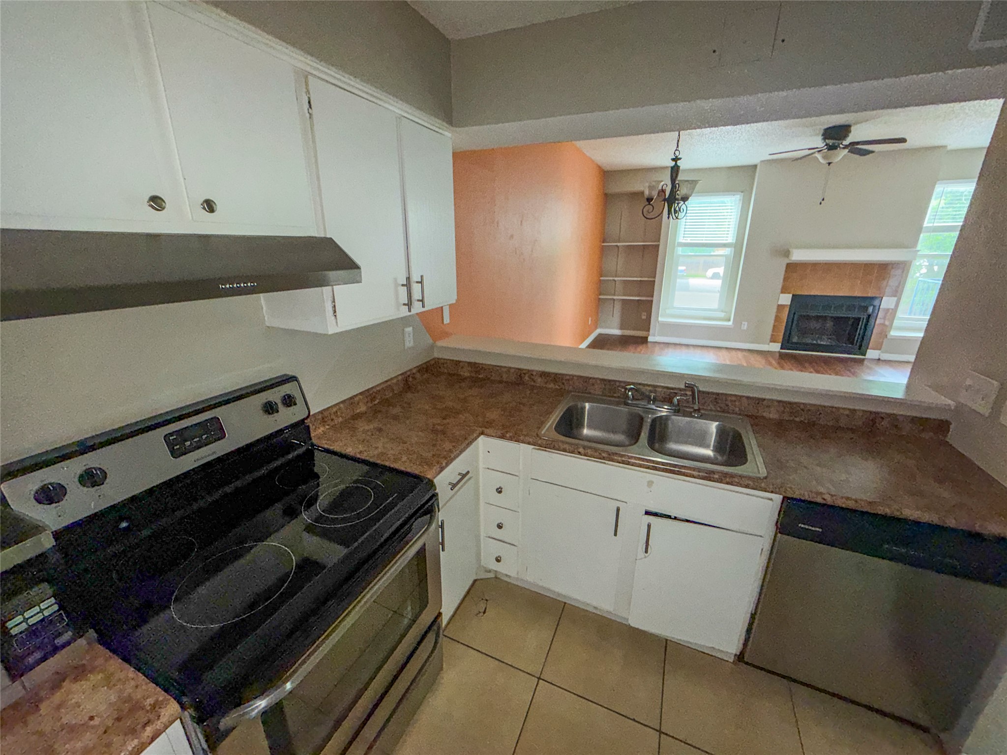 5313 Indio Drive, Unit D Austin, TX 78745 - Photo 6 of 17 a kitchen with a stove and a sink