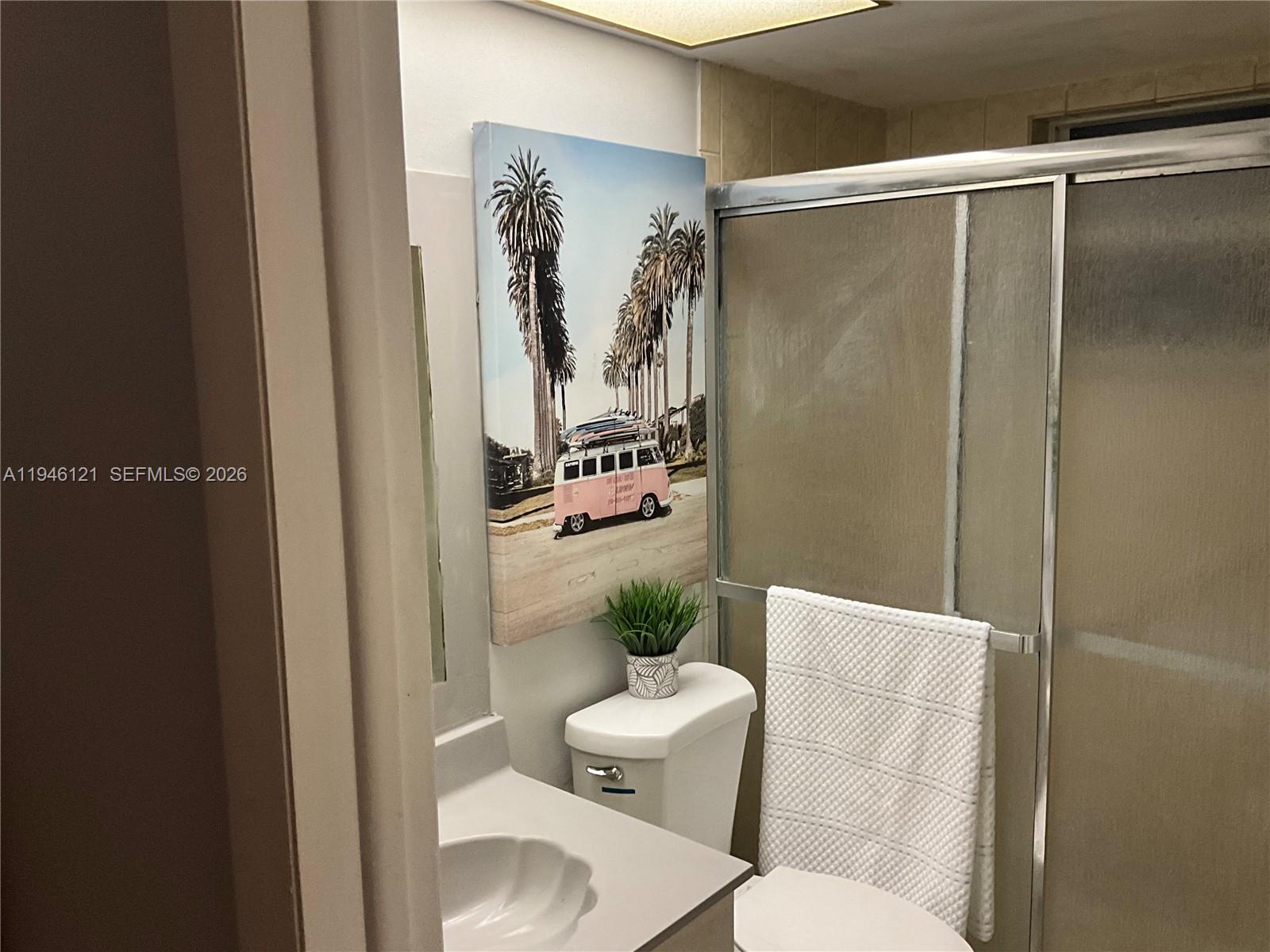 101 Berkley Road, Unit 205 Hollywood, FL 33024 - Photo 13 of 13 a bathroom with a shower toilet and sink