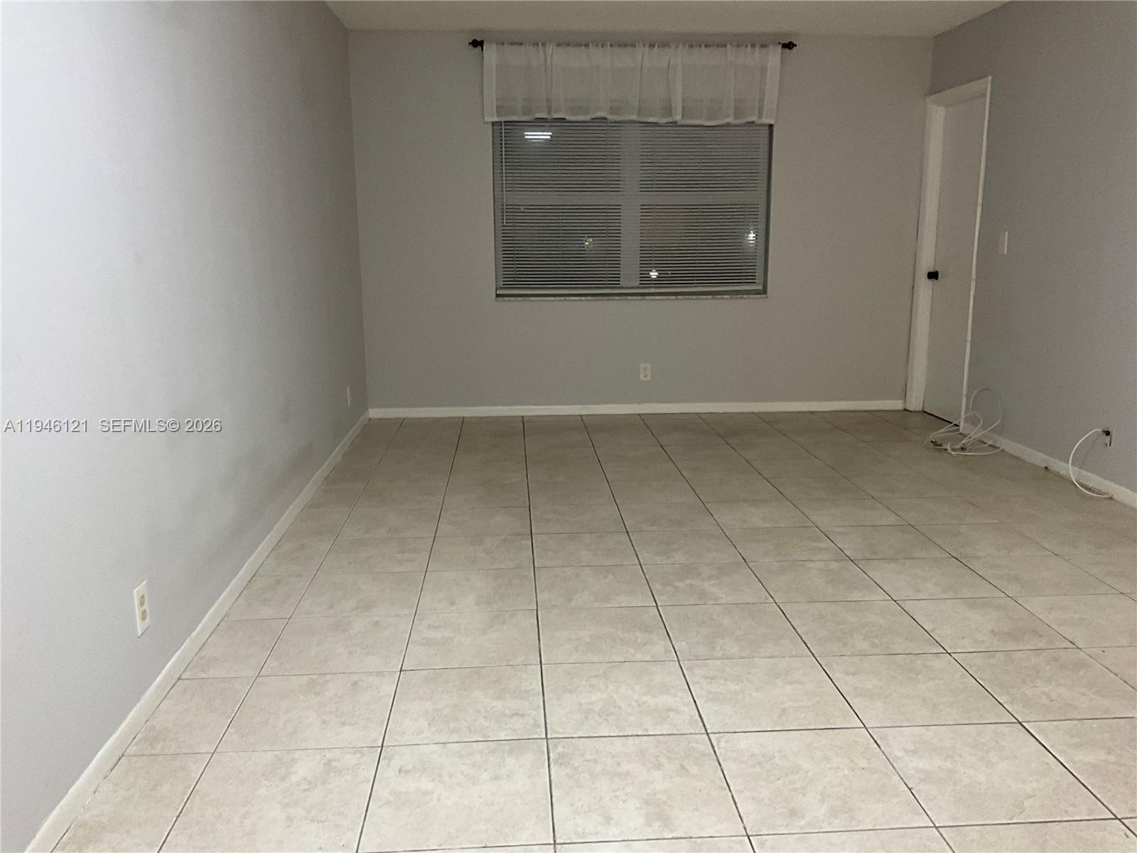 101 Berkley Road, Unit 205 Hollywood, FL 33024 - Photo 5 of 13 a view of an empty room