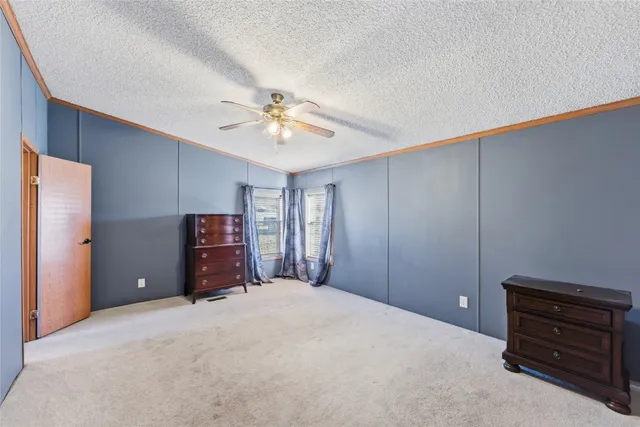 a bedroom with a bed and a closet