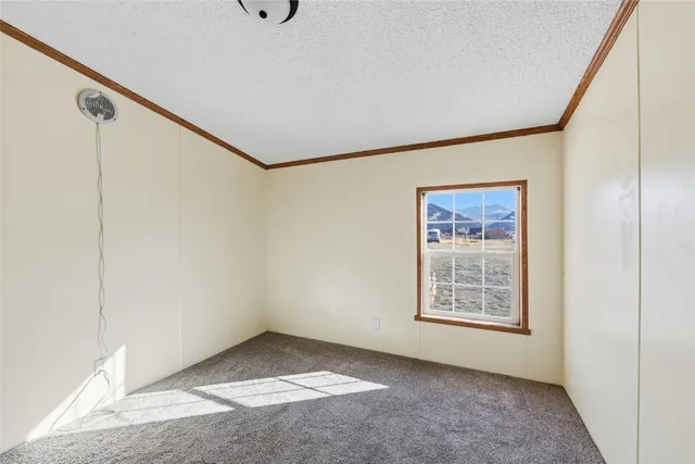 a view of an empty room with windows