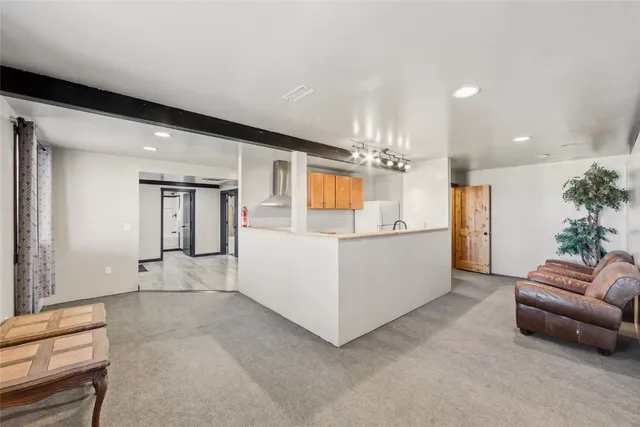 a living room with furniture and a table