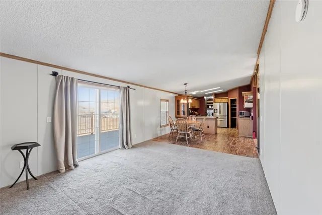 an empty room with furniture and a window