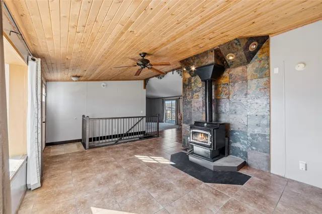 a view of a livingroom with furniture and staircase