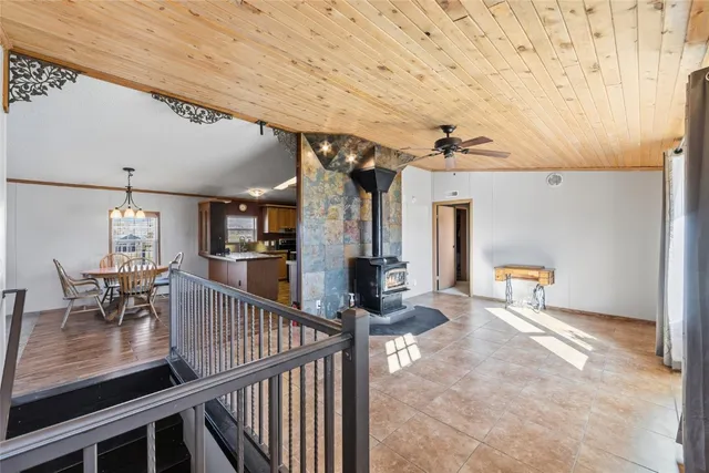 a view of a livingroom with furniture and staircase
