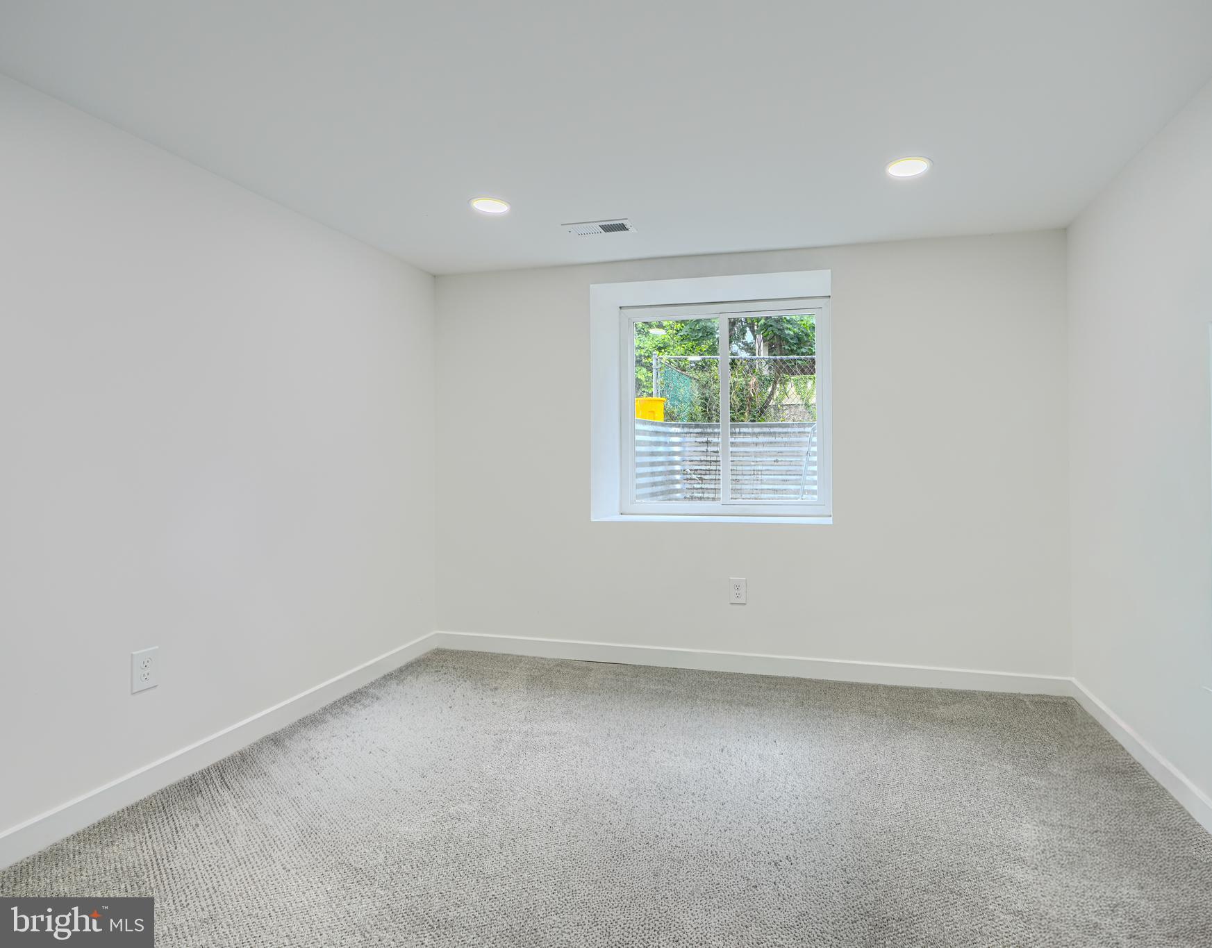 3410 Pinkney Road Baltimore, MD 21215 - Photo 41 of 55 an empty room with windows