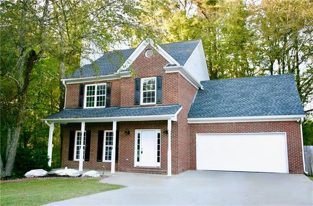 front view of a house with a yard