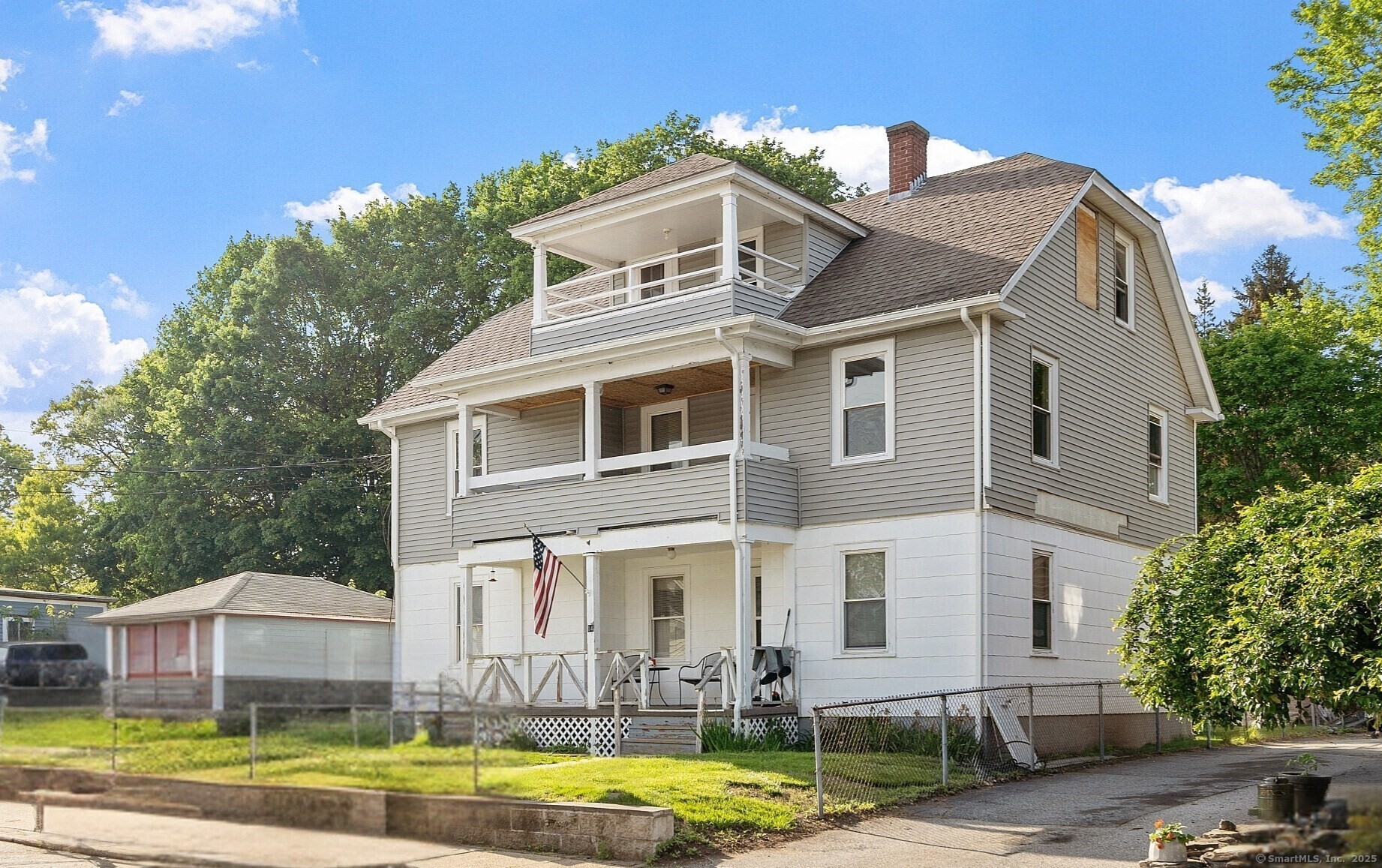 a front view of a residential houses with yard