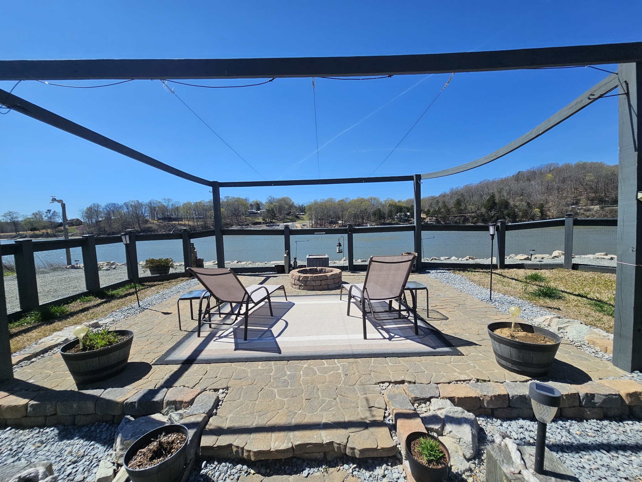 1803 Hardin Bottom River Road Clifton, TN 38425 - Photo 12 of 60 a view of a balcony with chairs and potted plants