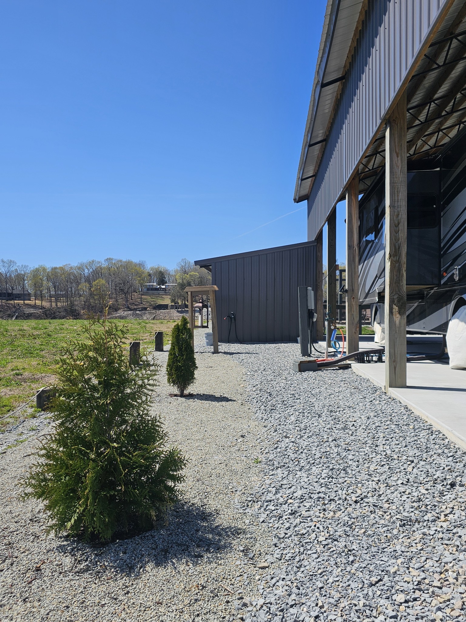 1803 Hardin Bottom River Road Clifton, TN 38425 - Photo 22 of 60 a view of a backyard with plants and lake view