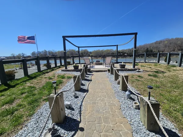 a view of a backyard with sitting area