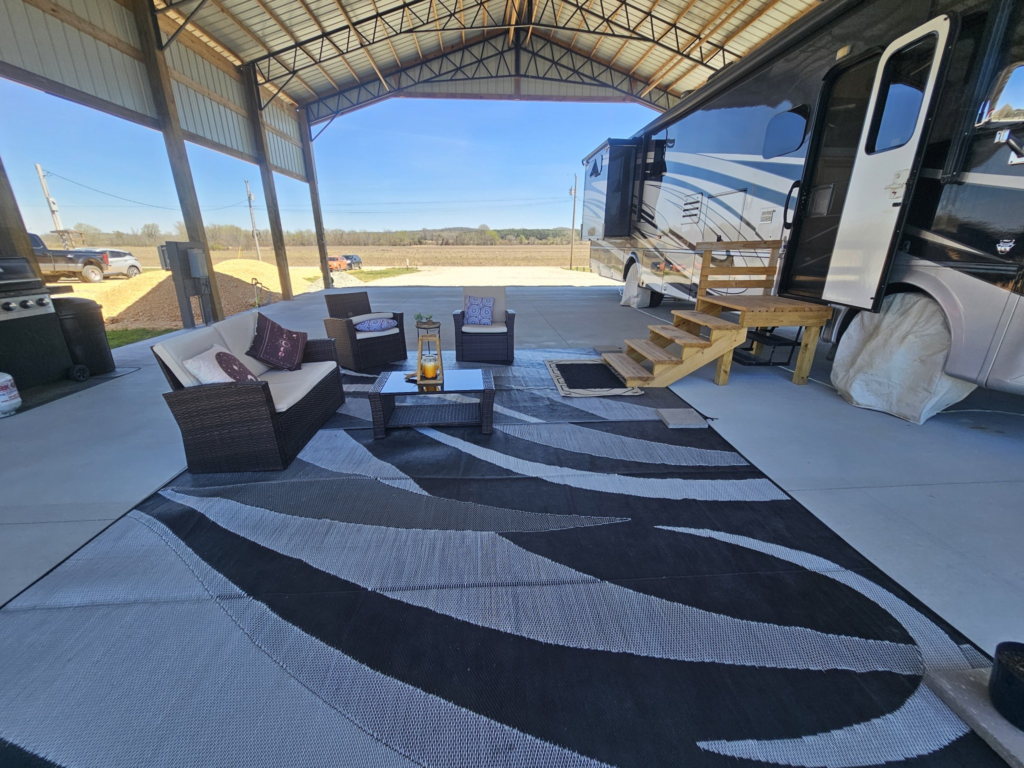 1803 Hardin Bottom River Road Clifton, TN 38425 - Photo 5 of 60 a living room with couches chairs and large windows