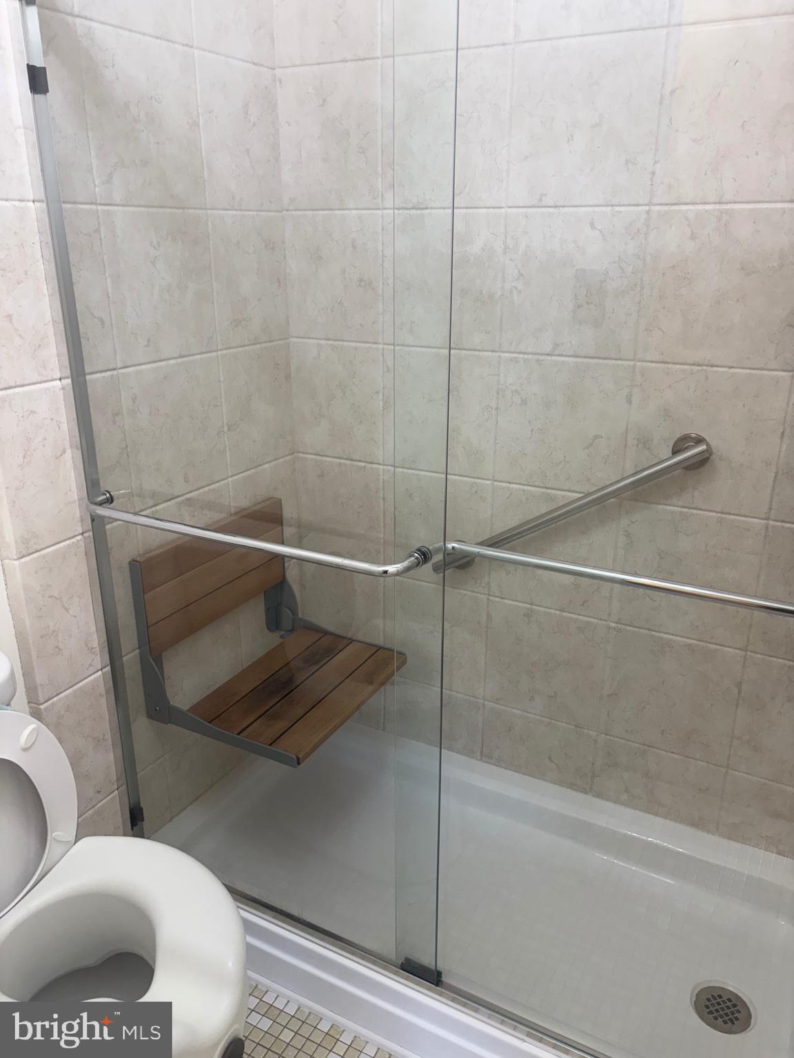 11829 Academy Road, Unit 29B Philadelphia, PA 19154 - Photo 23 of 33 a bathroom with a toilet and a shower