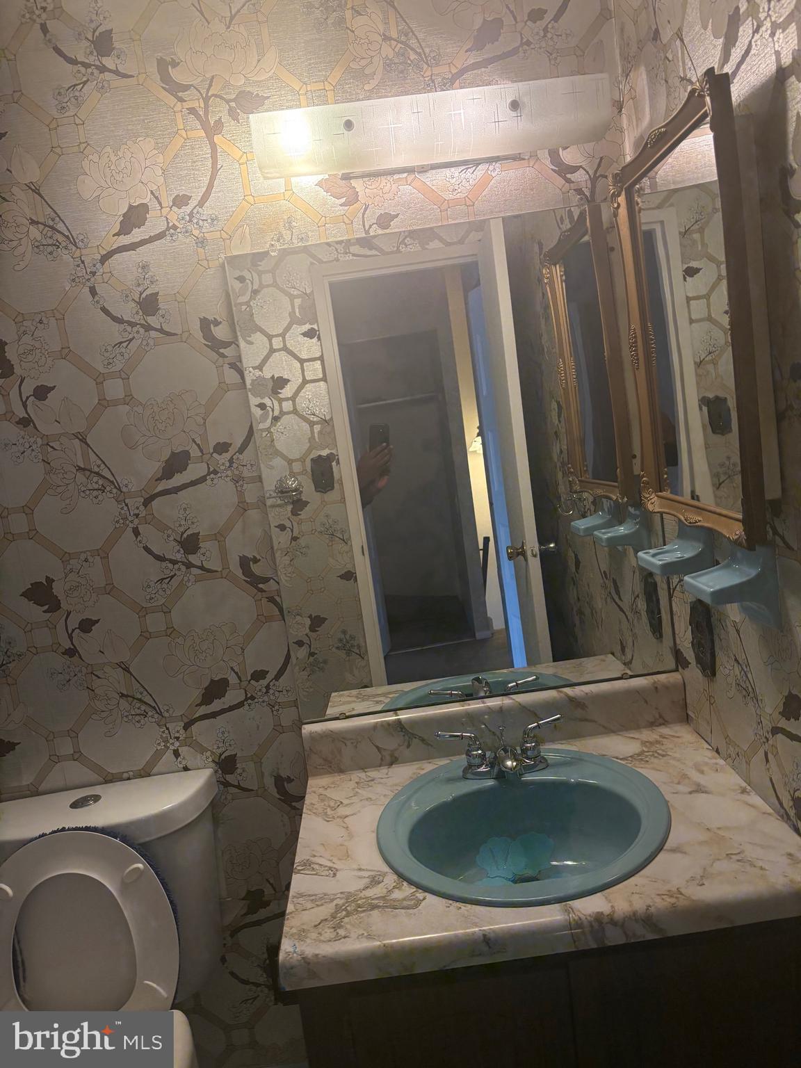 11829 Academy Road, Unit 29B Philadelphia, PA 19154 - Photo 25 of 33 a bathroom with a granite countertop sink and a mirror