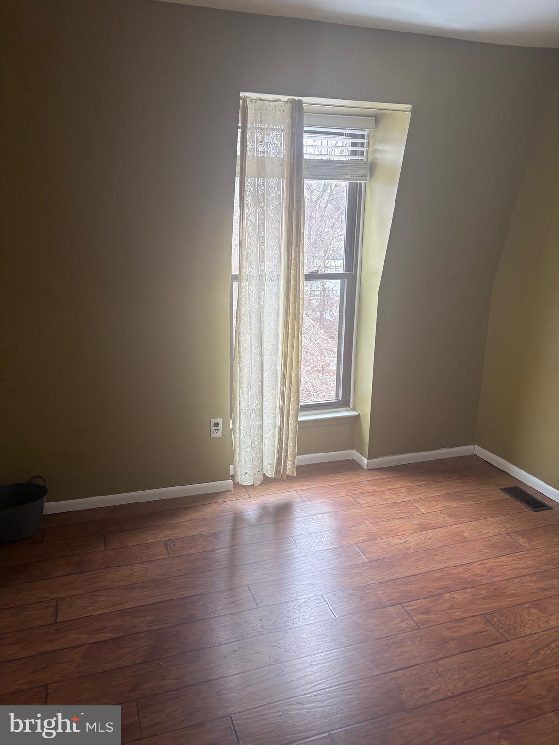 11829 Academy Road, Unit 29B Philadelphia, PA 19154 - Photo 28 of 33 an empty room with wooden floor and windows