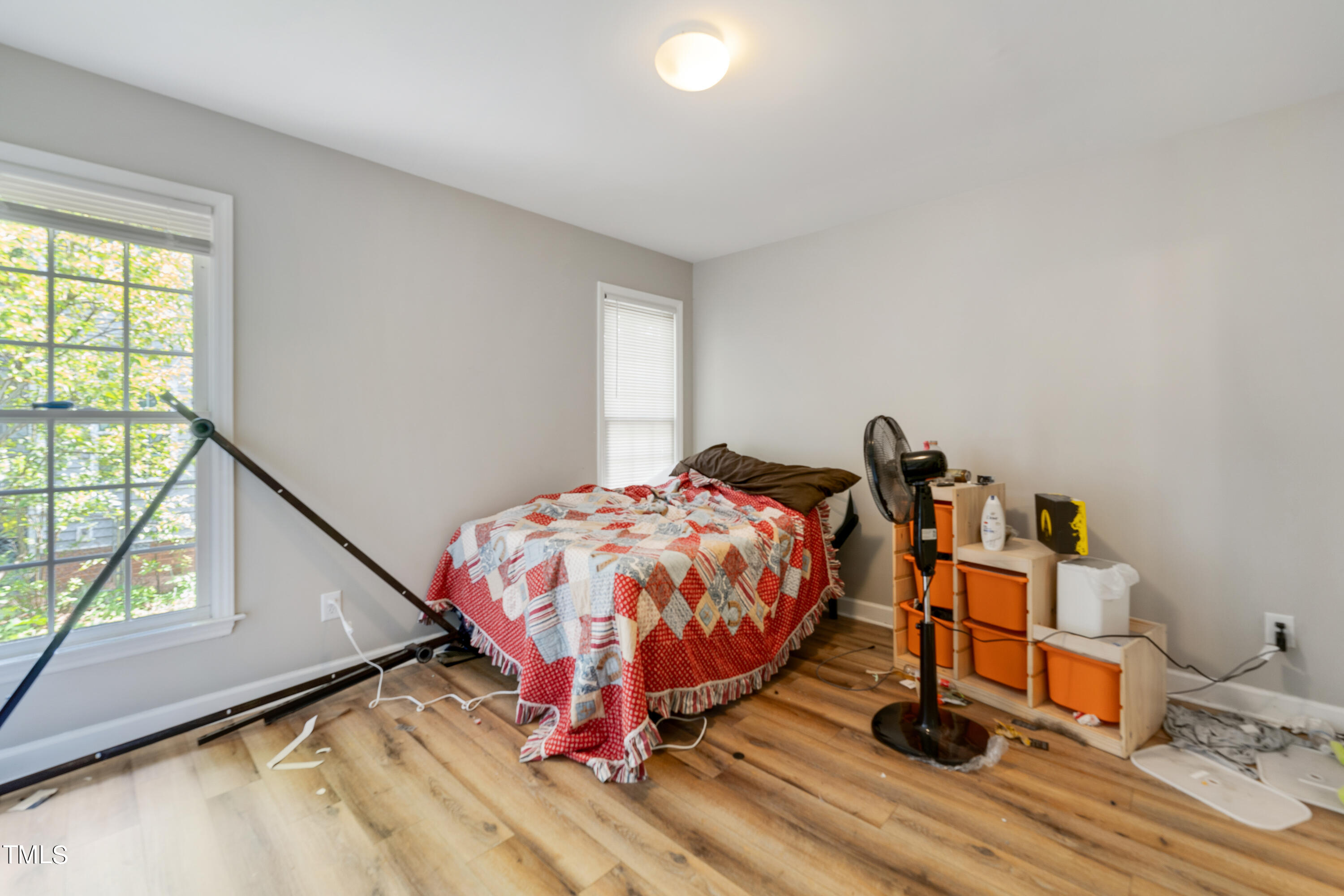 1005 Chaney Road Raleigh, NC 27606 - Photo 12 of 18 a bedroom with a bed and a window
