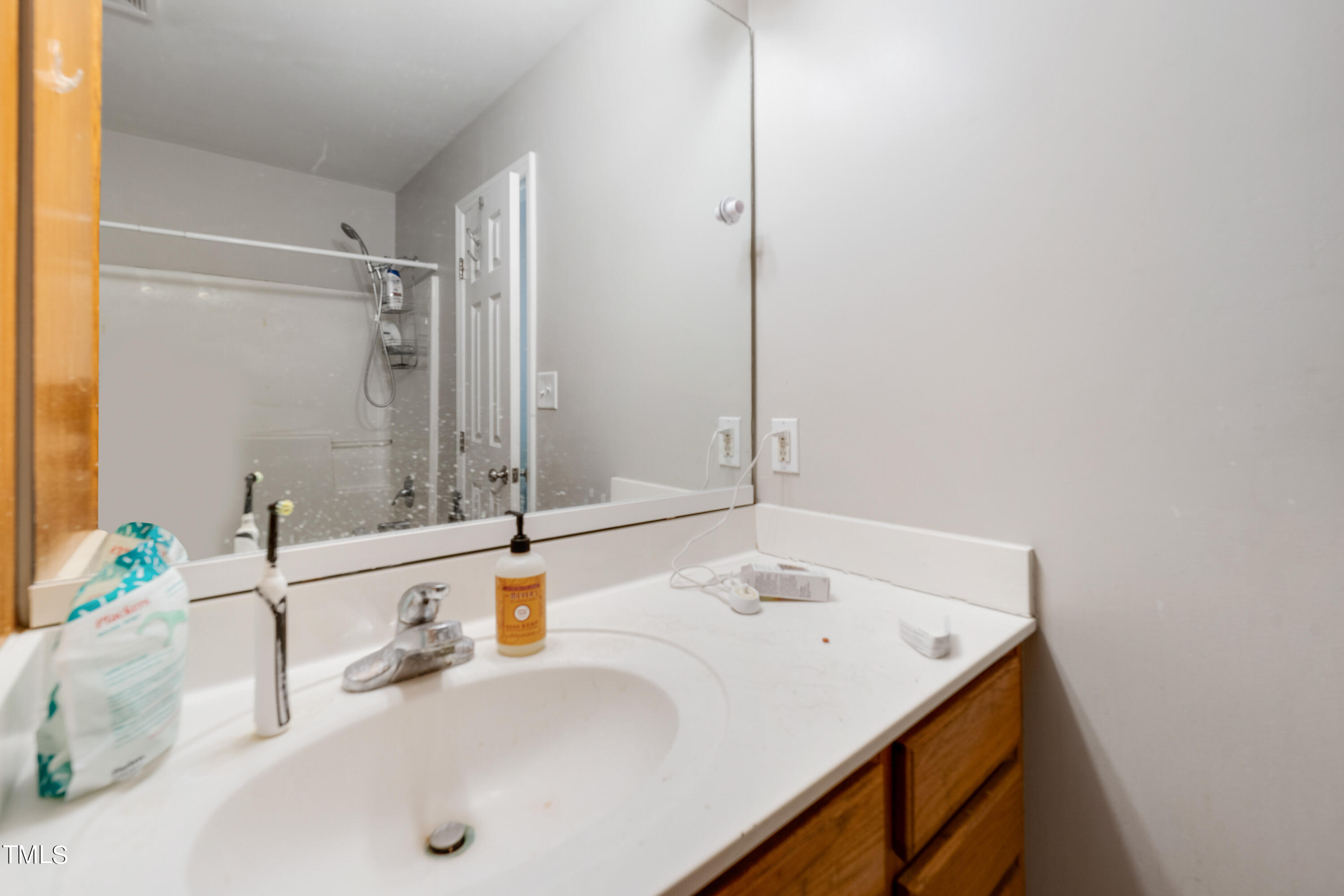 1005 Chaney Road Raleigh, NC 27606 - Photo 13 of 18 a bathroom with a sink and a tub