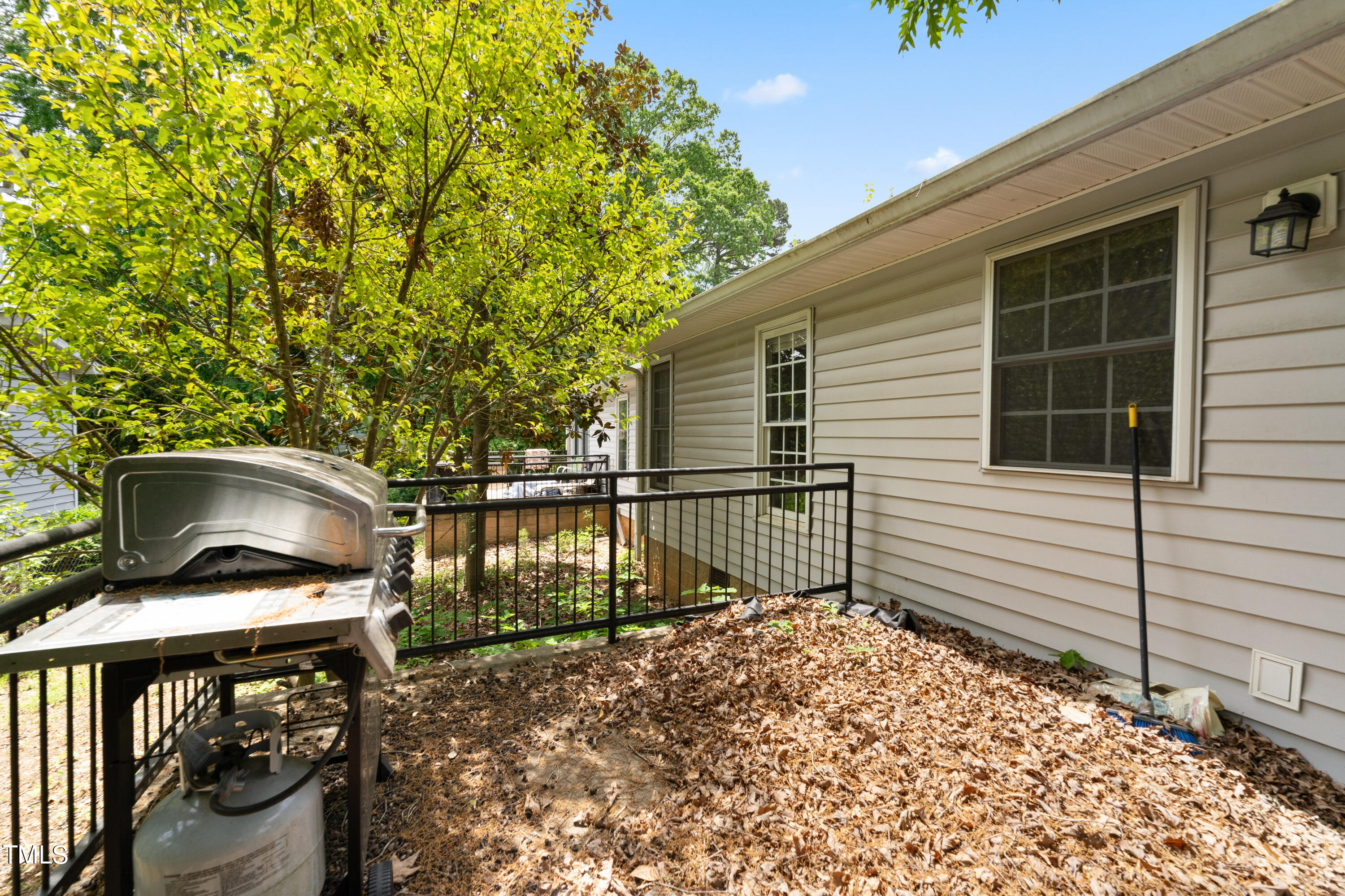 1005 Chaney Road Raleigh, NC 27606 - Photo 14 of 18 a view of a balcony with chairs