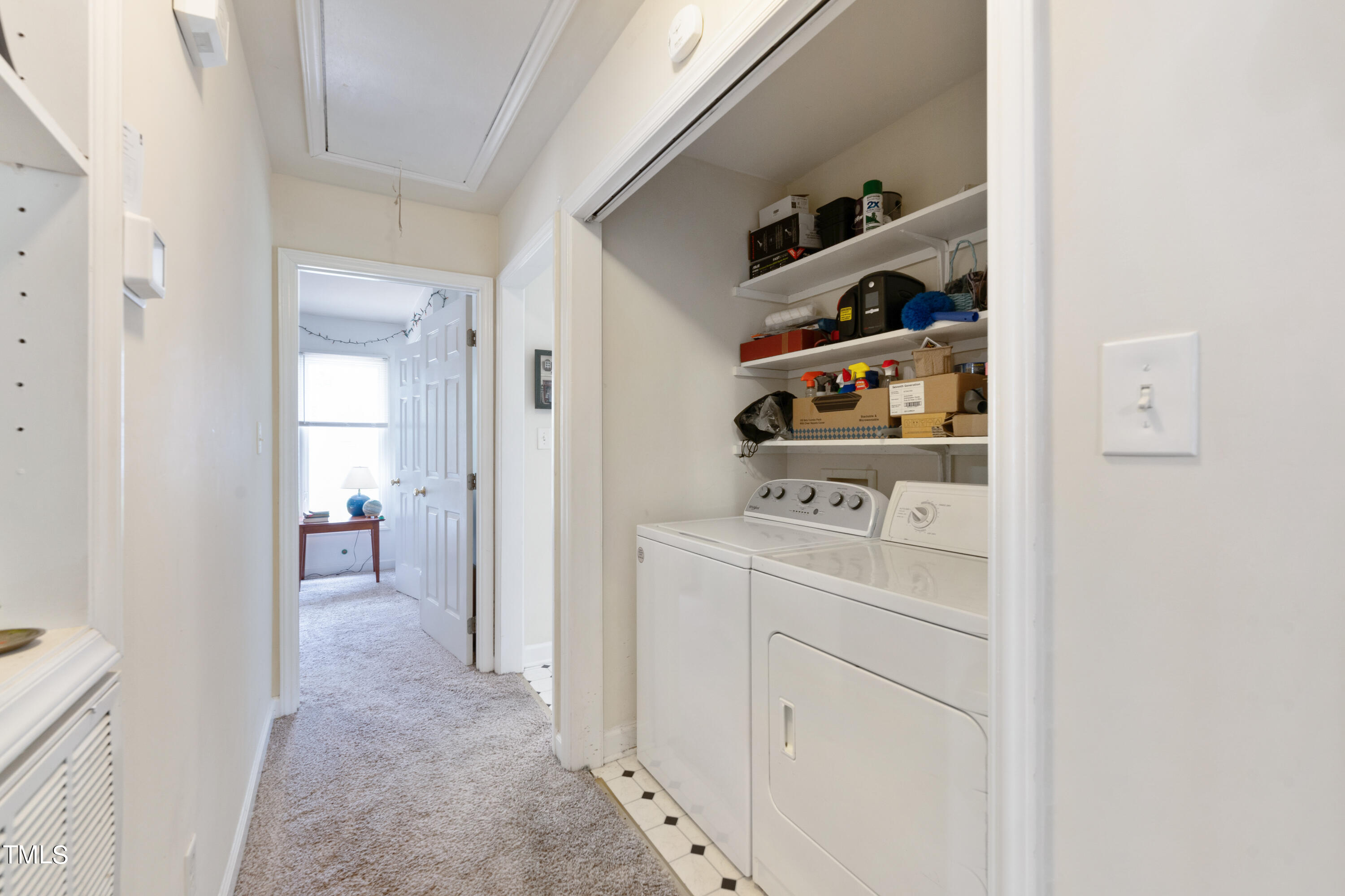 1005 Chaney Road Raleigh, NC 27606 - Photo 5 of 18 a view of walk in closet with clothes and shoes