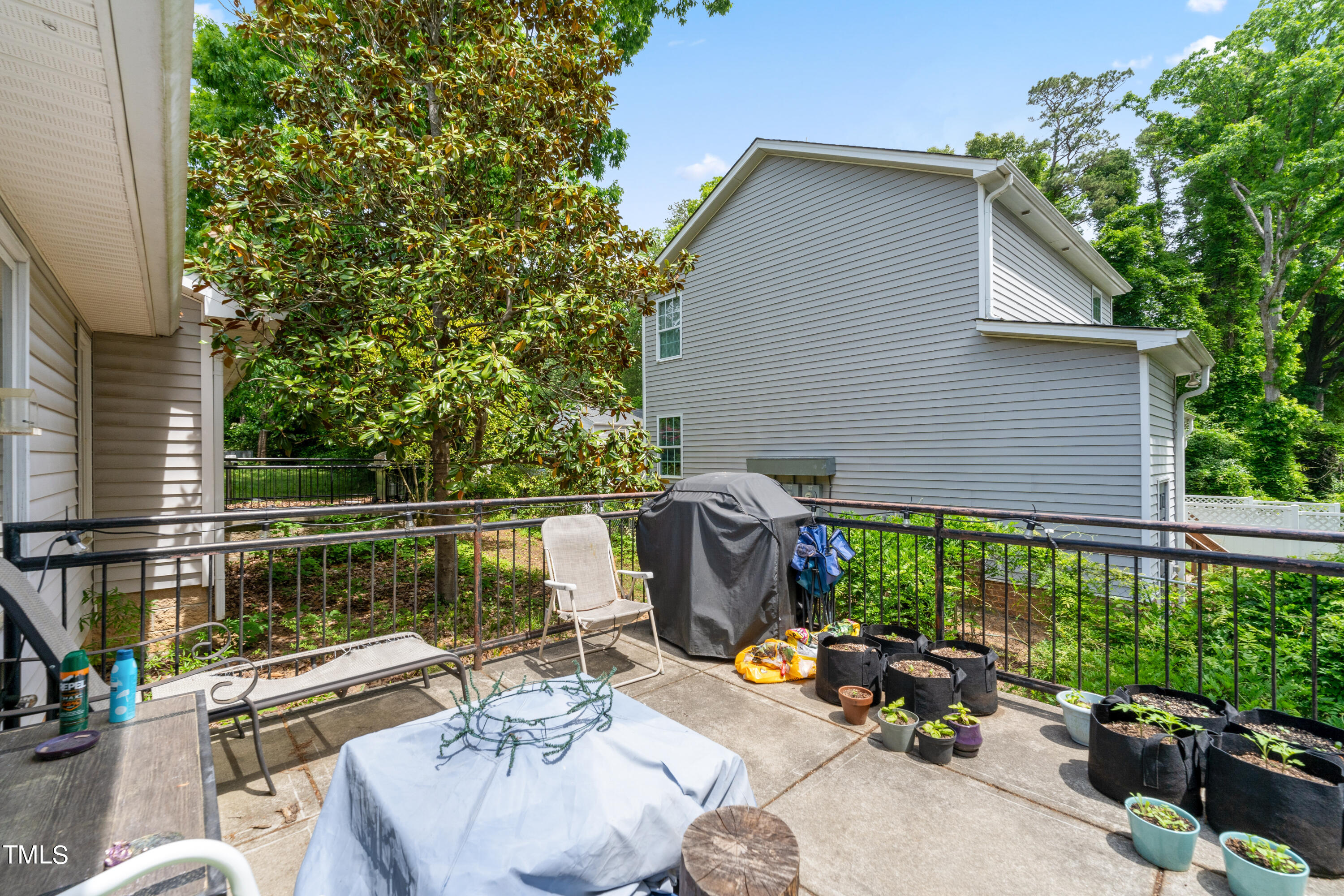 1005 Chaney Road Raleigh, NC 27606 - Photo 10 of 18 a view of backyard with outdoor seating and plants