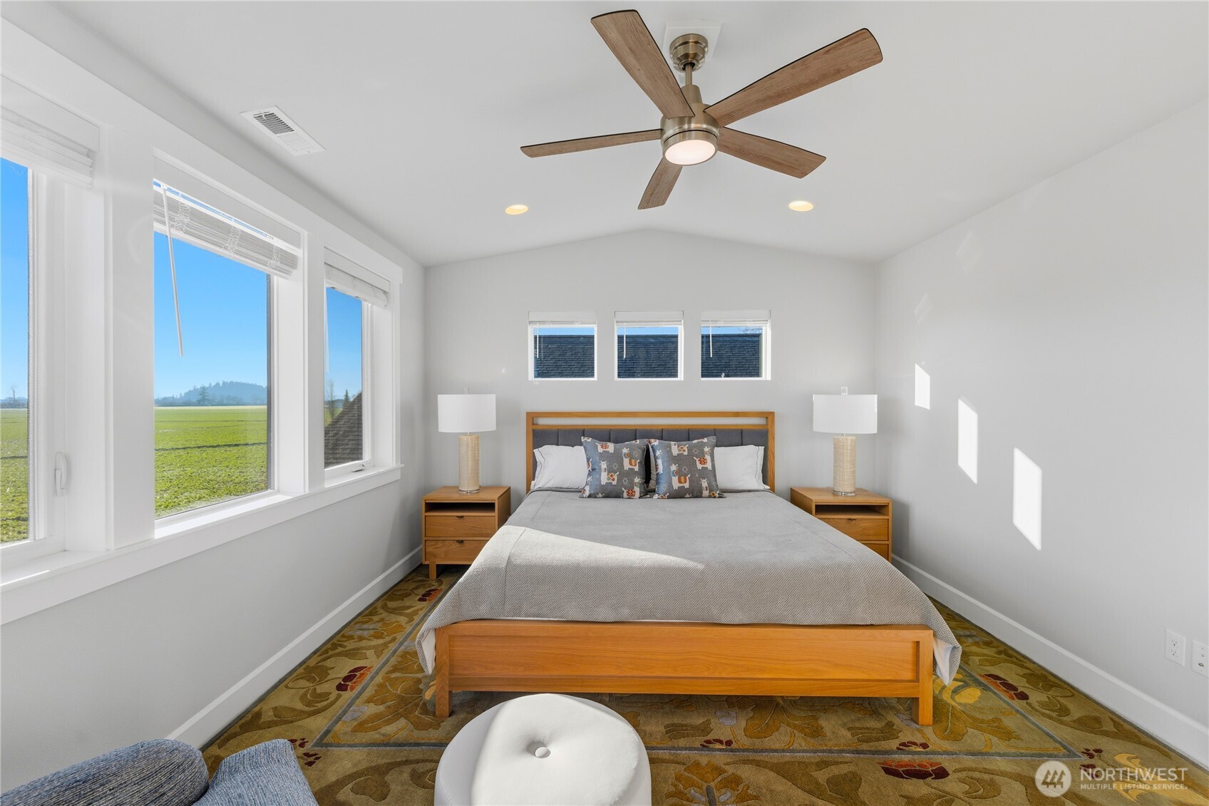 405 Maple Avenue La Conner, WA 98257 - Photo 13 of 40 a bedroom with a large bed and a window