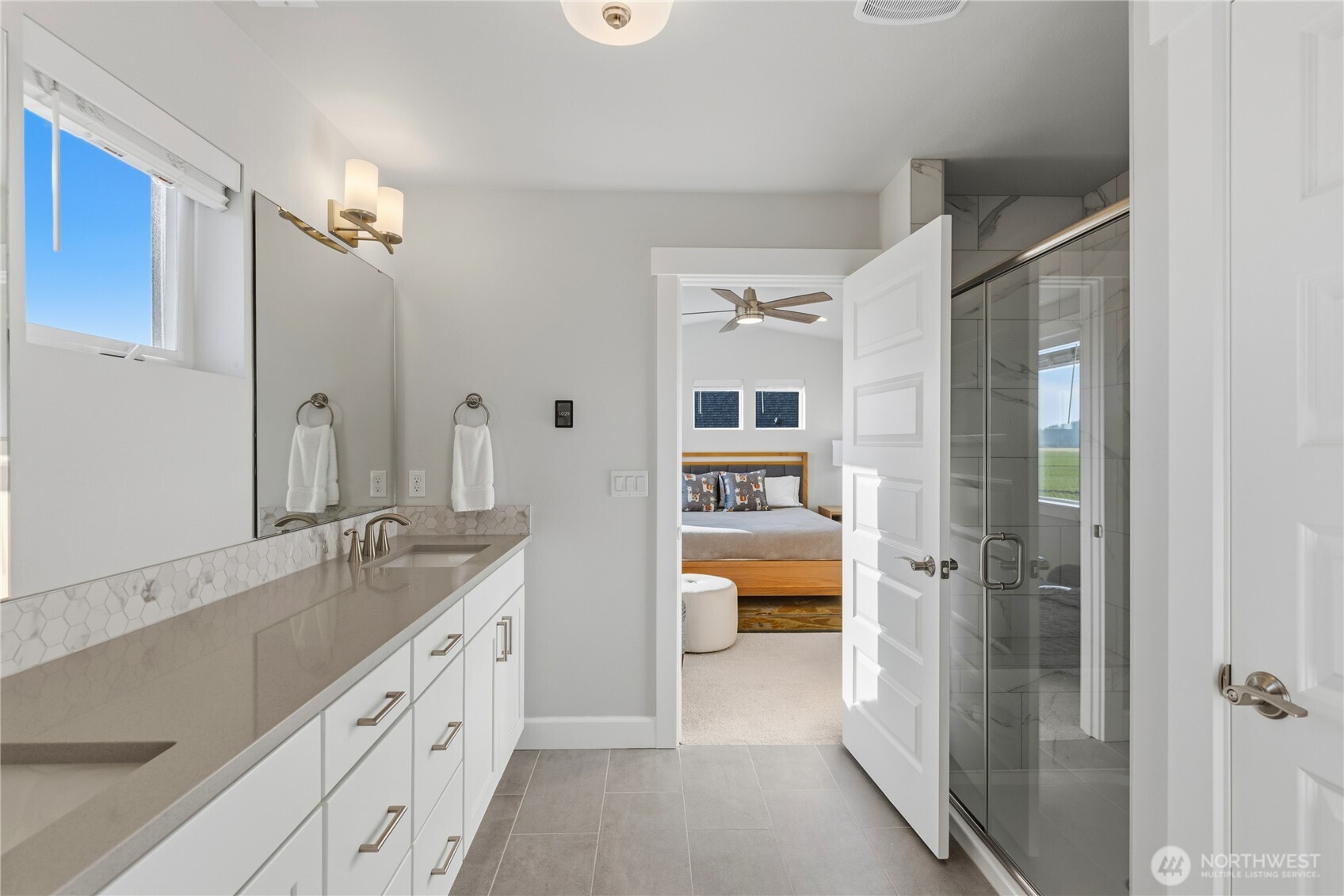 405 Maple Avenue La Conner, WA 98257 - Photo 17 of 40 a spacious bathroom with a granite countertop sink mirror and bathtub