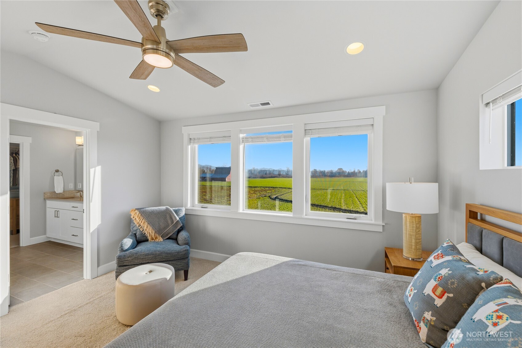 405 Maple Avenue La Conner, WA 98257 - Photo 18 of 40 a bedroom with furniture and a large window