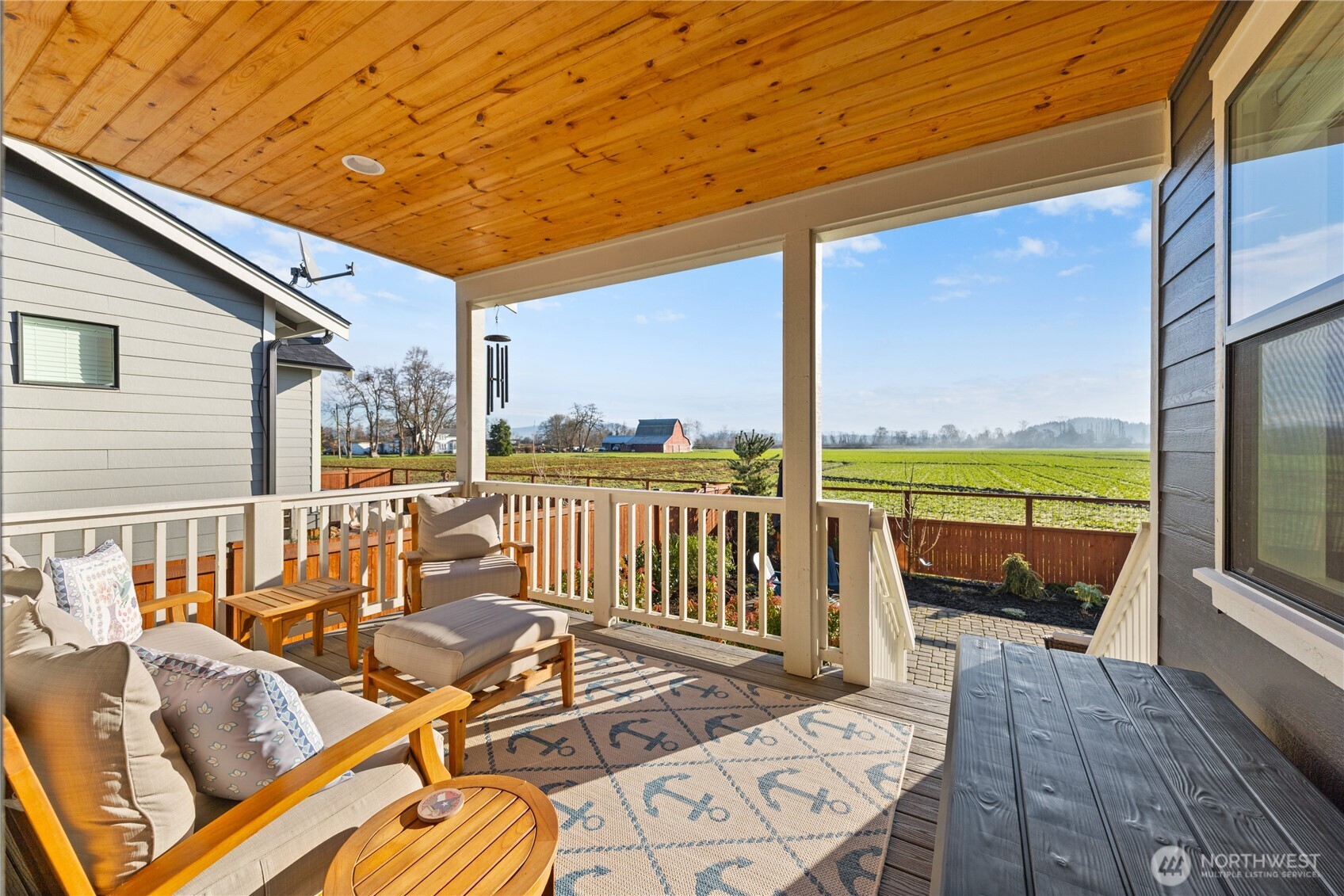 405 Maple Avenue La Conner, WA 98257 - Photo 2 of 40 a view of a patio with a table chairs and wooden floor
