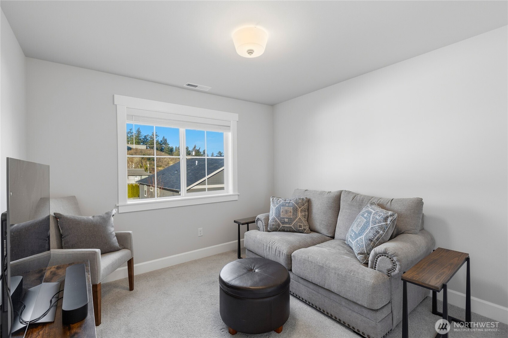 405 Maple Avenue La Conner, WA 98257 - Photo 22 of 40 a living room with furniture and a window