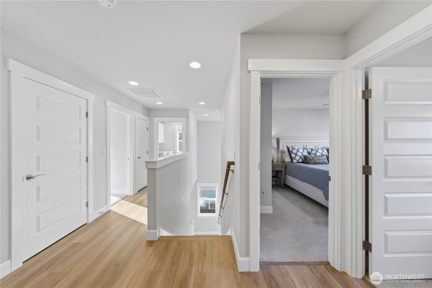 405 Maple Avenue La Conner, WA 98257 - Photo 25 of 40 a view of a hallway with wooden floor windows and a livingroom