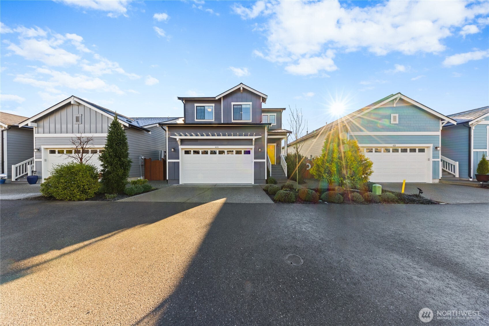 405 Maple Avenue La Conner, WA 98257 - Photo 36 of 40 a front view of a house with a yard and garage