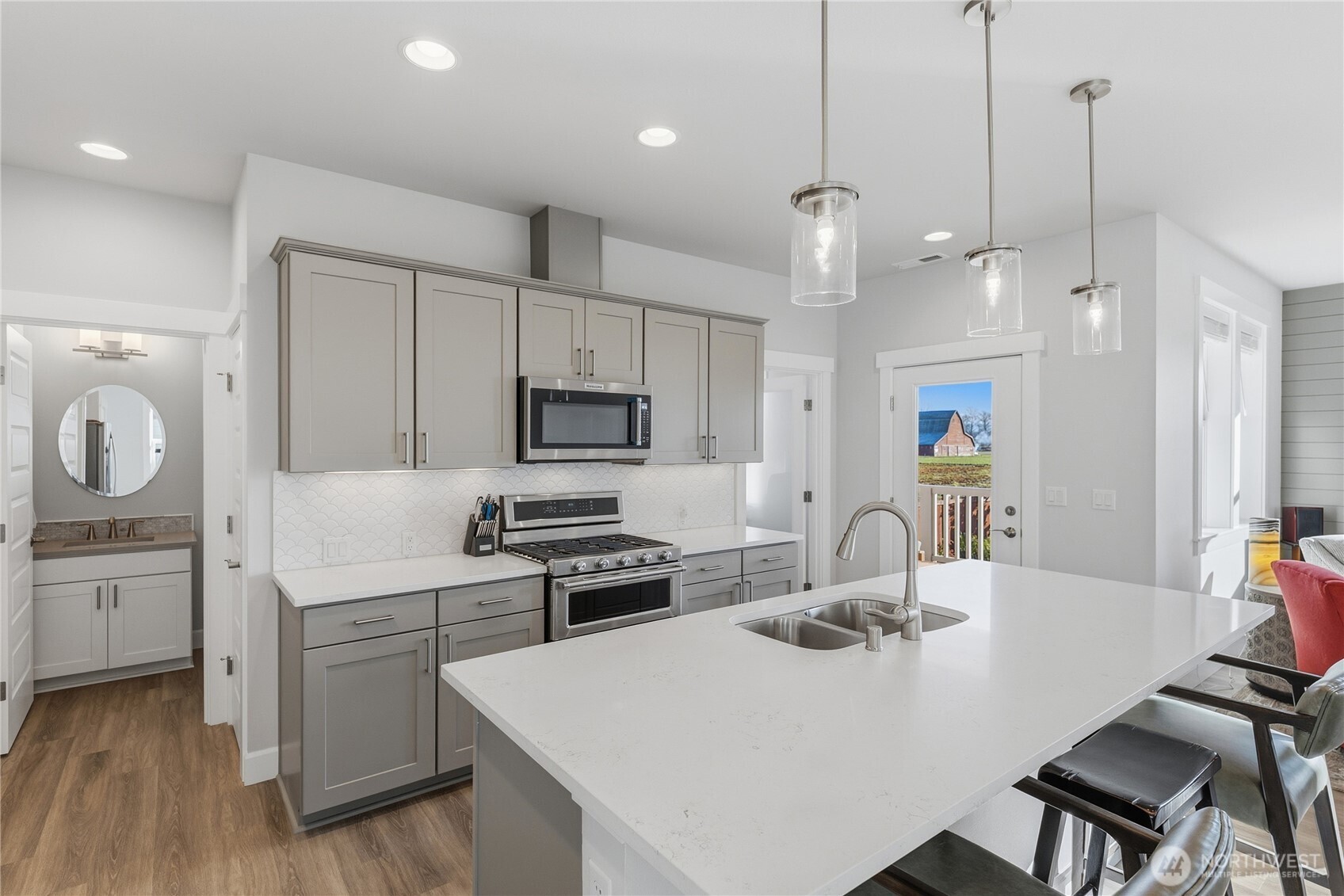 405 Maple Avenue La Conner, WA 98257 - Photo 8 of 40 a kitchen with sink a stove and chairs