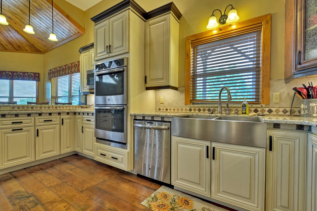 45 Flat Top Trail Murphy, NC 28906 - Photo 18 of 53 a kitchen with stainless steel appliances granite countertop a sink and cabinets