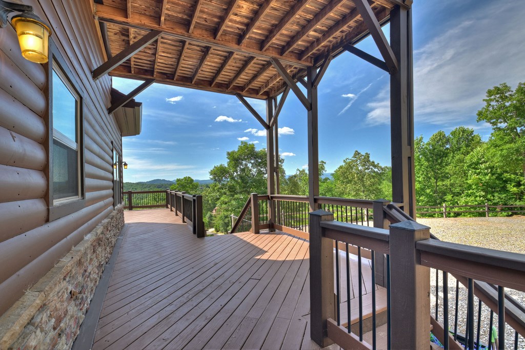 45 Flat Top Trail Murphy, NC 28906 - Photo 8 of 53 a view of a balcony with chairs and wooden floor