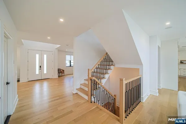 a view of staircase with white walls and windows