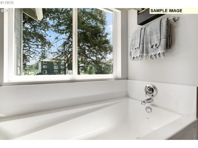 a bathroom with a bathtub and shower
